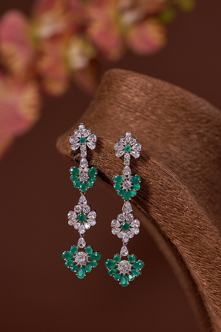 White Finish Zircon & Synthetic Emerald Dangler Earrings In Sterling Silver by STELLA CREATIONS at Pernia's Pop Up Shop