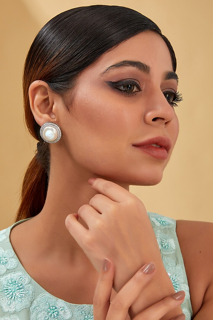 White Finish Zircon & Freshwater Pearl Stud Earrings In Sterling Silver by STELLA CREATIONS at Pernia's Pop Up Shop