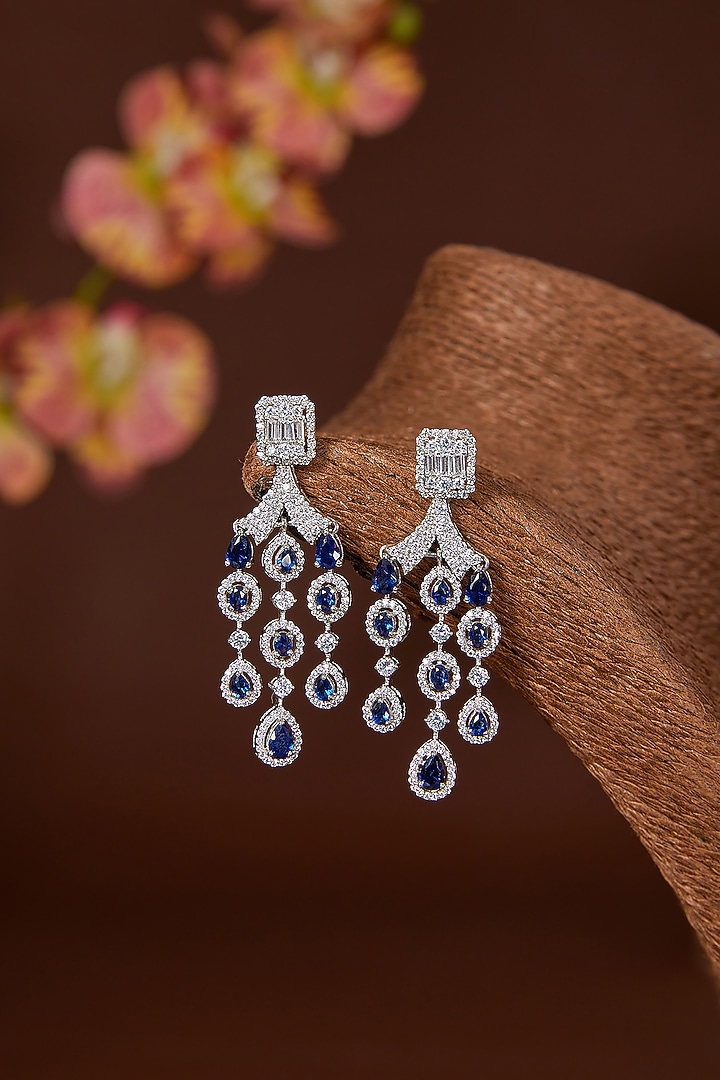 White Finish Zircon & Synthetic Blue Sapphire Dangler Earrings In Sterling Silver by STELLA CREATIONS at Pernia's Pop Up Shop