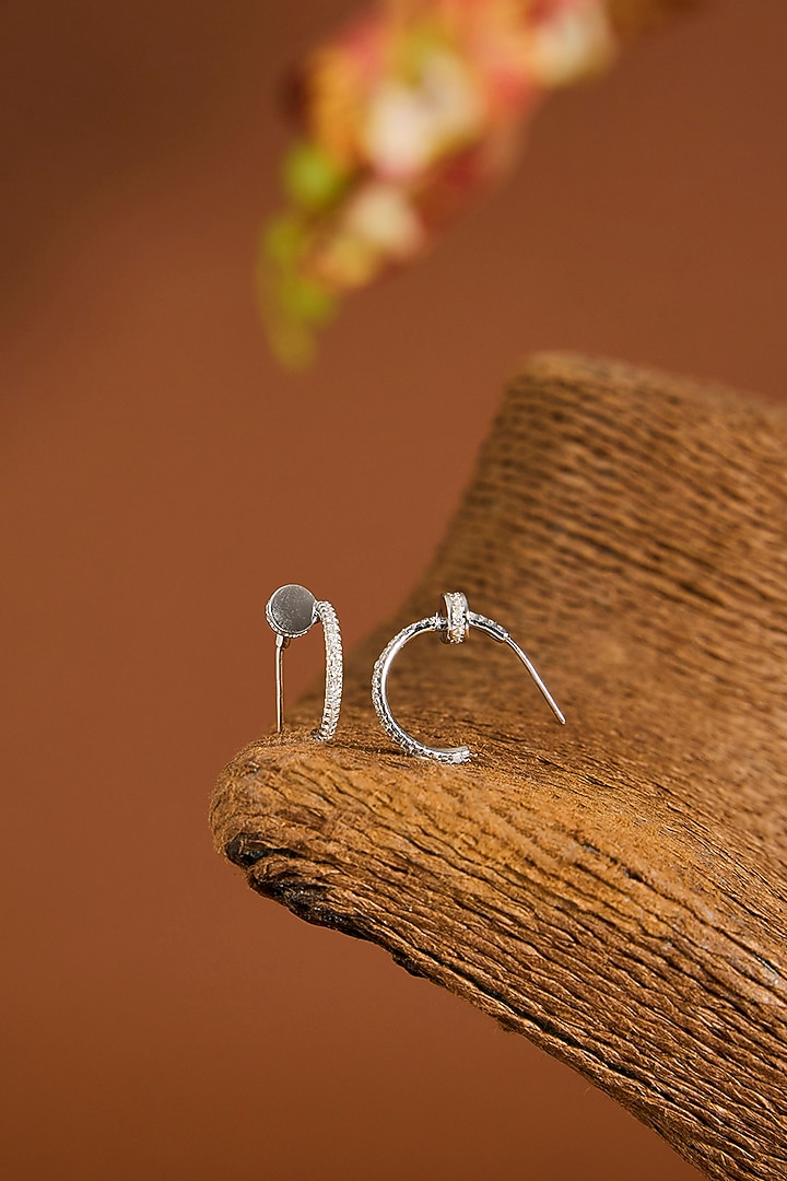 White Gold Finish Zircon Hoop Earrings In Sterling Silver by STELLA CREATIONS at Pernia's Pop Up Shop