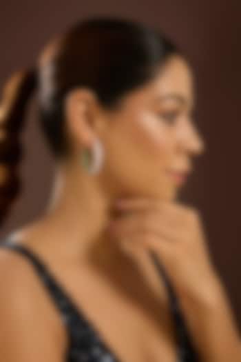 White Gold Finish Zircon & Emerald Stone Hoop Earrings In Sterling Silver by STELLA CREATIONS at Pernia's Pop Up Shop