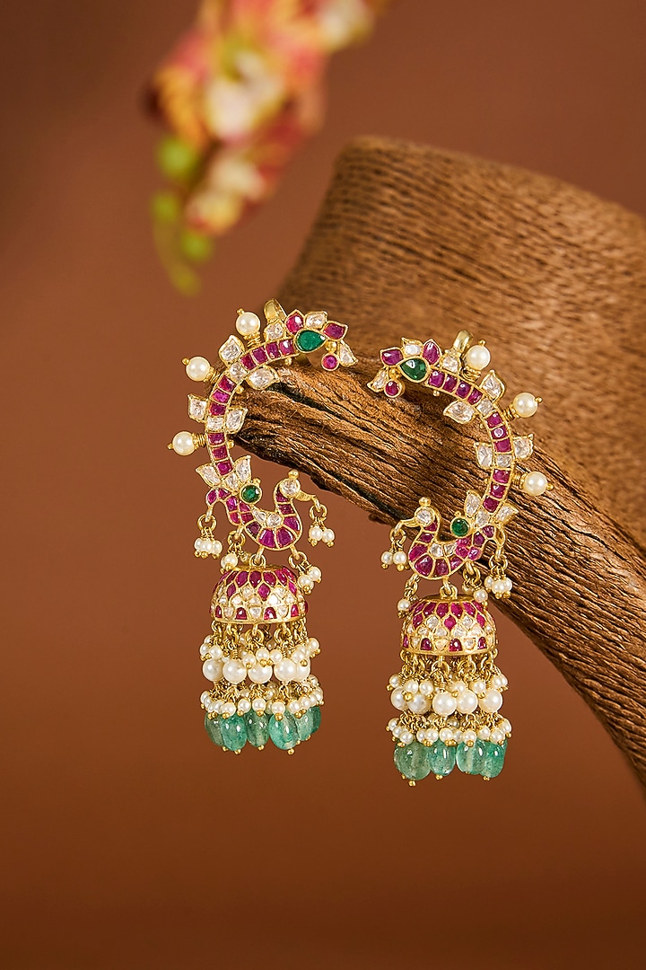 Yellow Gold Finish Moissanite Polki & Emerald Stone Jhumka Earrings In Sterling Silver by STELLA CREATIONS at Pernia's Pop Up Shop