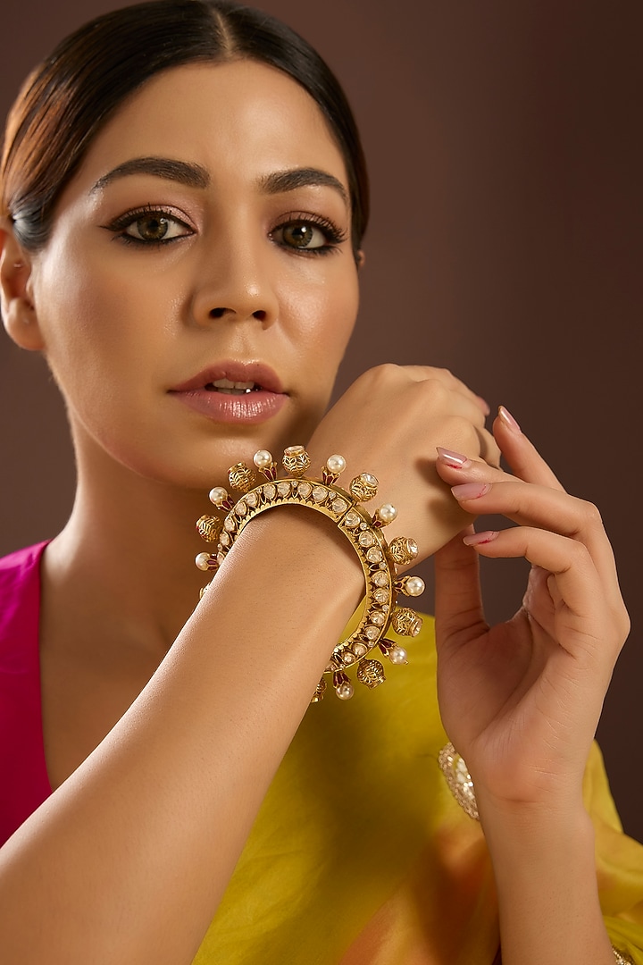 Yellow Gold Finish Moissanite Polki & Swarovski Zircon Bangle In Sterling Silver by STELLA CREATIONS at Pernia's Pop Up Shop