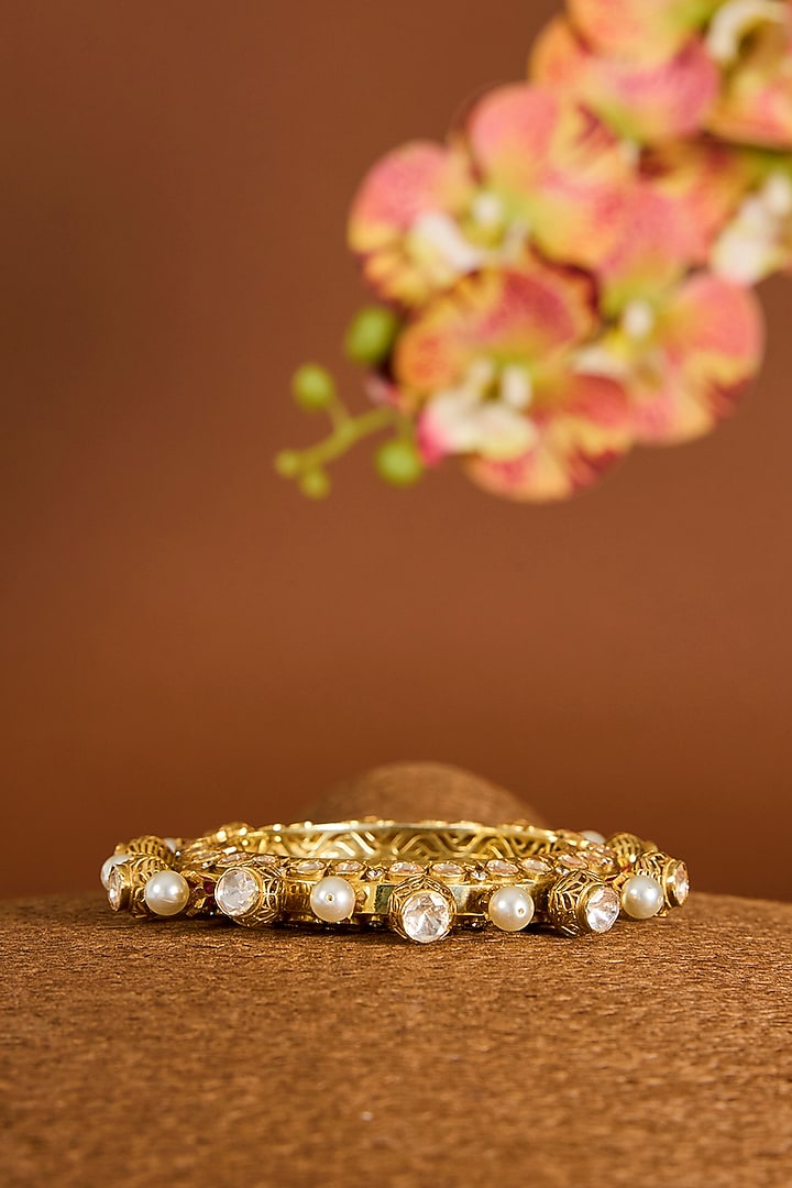 Yellow Gold Finish Moissanite Polki & Swarovski Zircon Bangle In Sterling Silver by STELLA CREATIONS at Pernia's Pop Up Shop