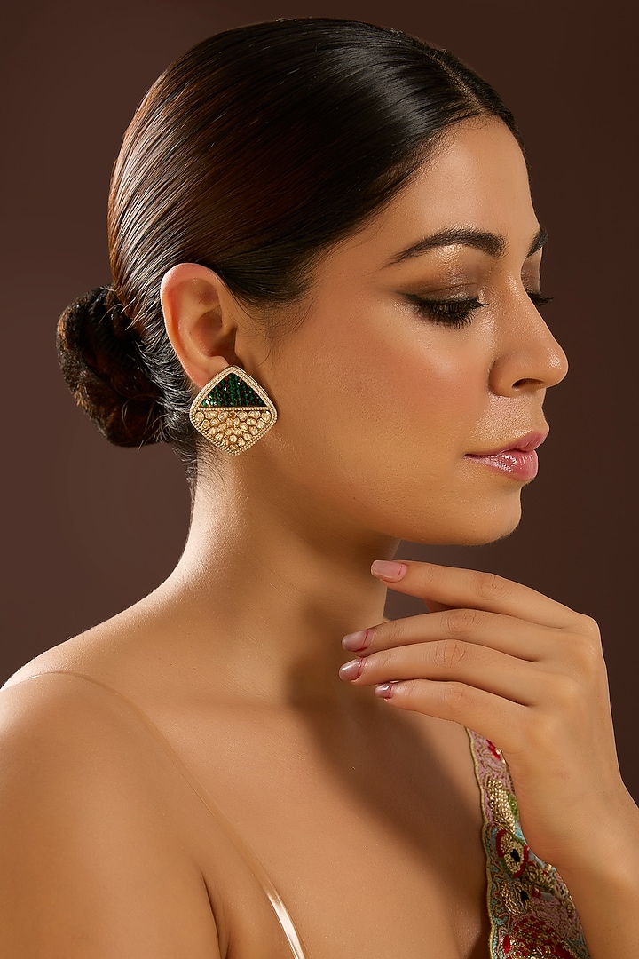 Yellow Gold Finish Moissanite Polki & Emerald Stone Stud Earrings In Sterling Silver by STELLA CREATIONS at Pernia's Pop Up Shop