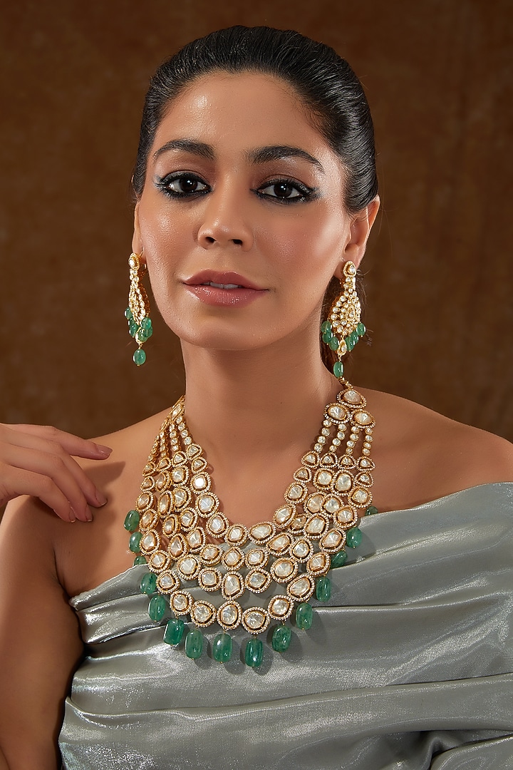 Gold Finish Moissanite Polki & Synthetic Emerald Stone Necklace Set In Sterling Silver by STELLA CREATIONS at Pernia's Pop Up Shop