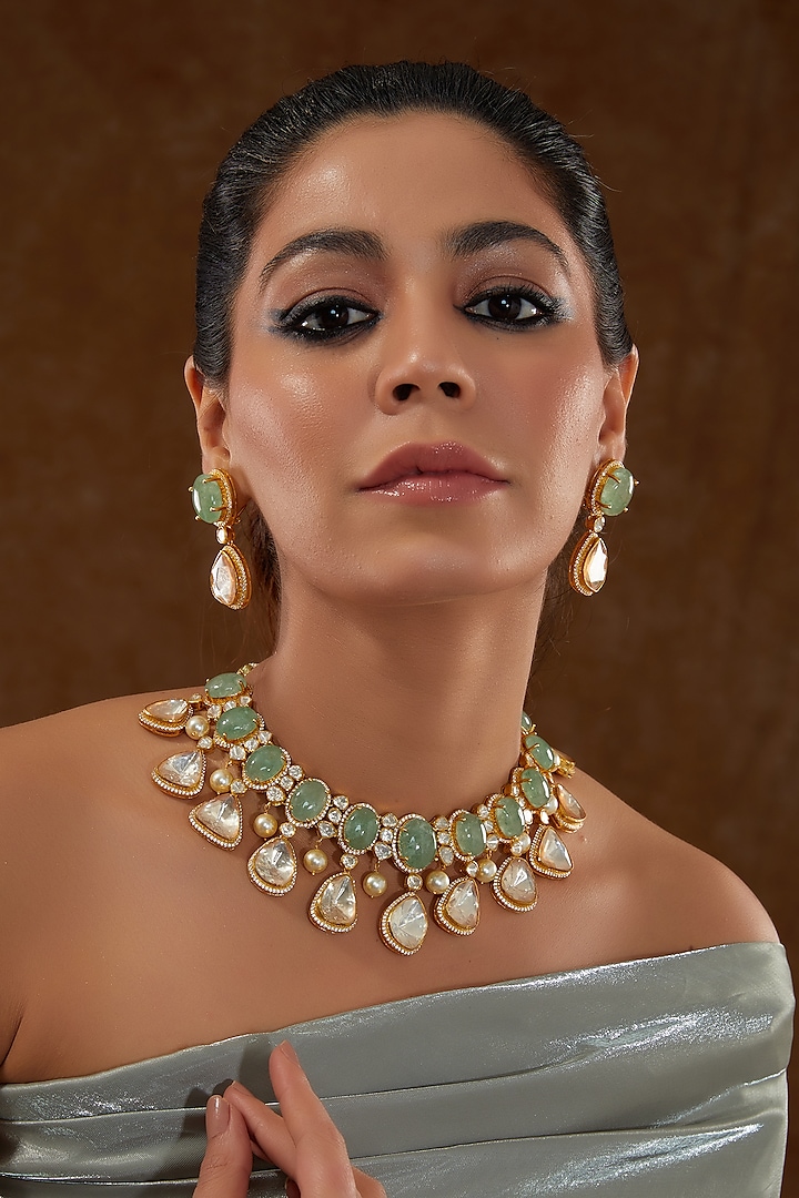 Gold Finish Moissanite Polki & Synthetic Emerald Stone Necklace Set In Sterling Silver by STELLA CREATIONS at Pernia's Pop Up Shop