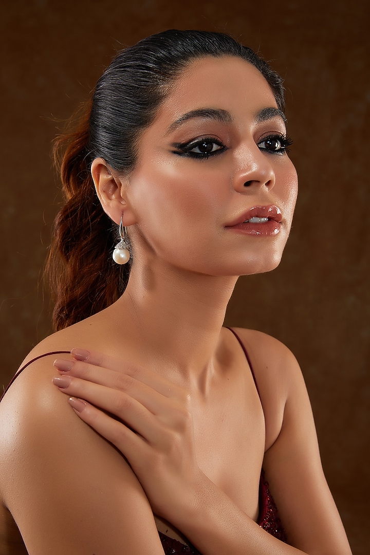 White Gold Finish Zircon & Freshwater Pearl Dangler Earrings In Sterling Silver by STELLA CREATIONS at Pernia's Pop Up Shop