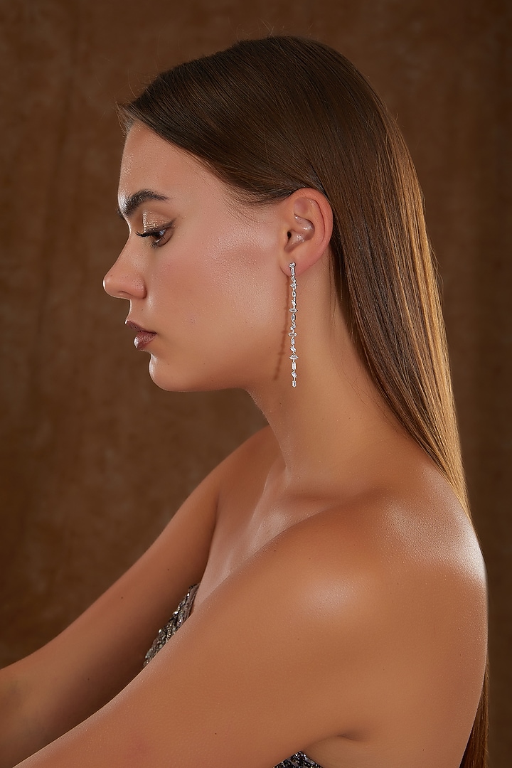 White Gold Finish Zircon Dangler Earrings In Sterling Silver by STELLA CREATIONS at Pernia's Pop Up Shop