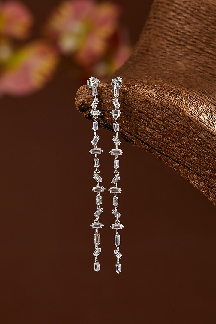 White Gold Finish Zircon Dangler Earrings In Sterling Silver by STELLA CREATIONS at Pernia's Pop Up Shop