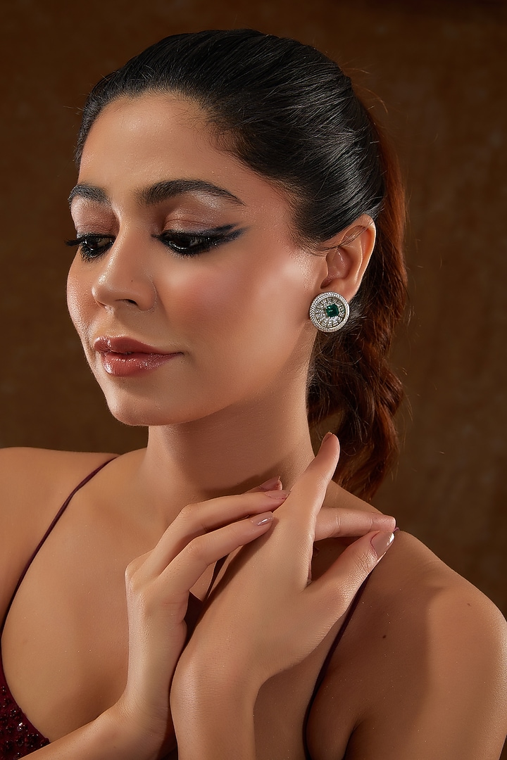 White Gold Finish Zircon & Synthetic Emerald Stone Stud Earrings In Sterling Silver by STELLA CREATIONS at Pernia's Pop Up Shop