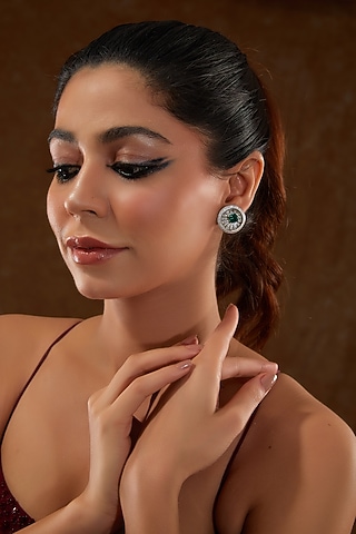 White Gold Finish Zircon & Synthetic Emerald Stone Stud Earrings In Sterling Silver by STELLA CREATIONS