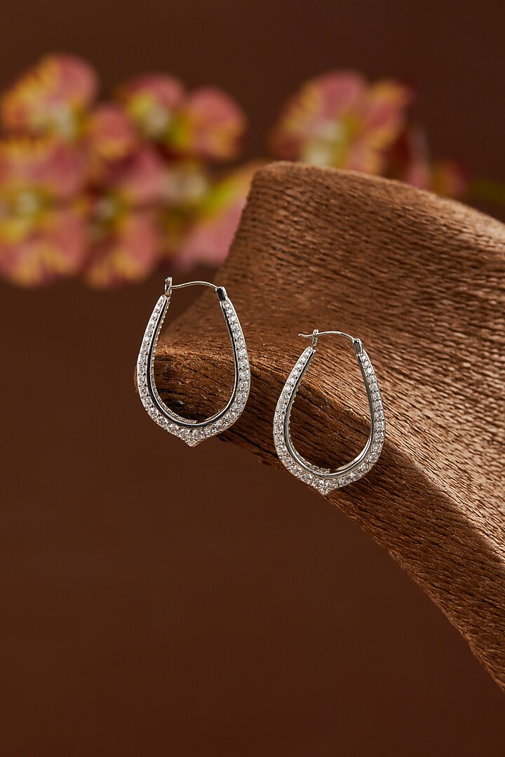 White Gold Finish Zircon Hoop Earrings In Sterling Silver by STELLA CREATIONS at Pernia's Pop Up Shop