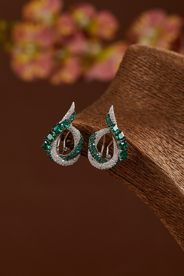 White Gold Finish Zircon & Synthetic Emerald Stone Stud Earrings In Sterling Silver by STELLA CREATIONS at Pernia's Pop Up Shop