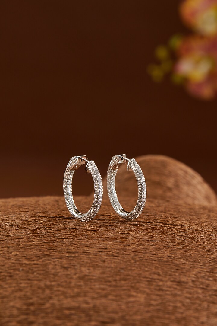 White Gold Finish Zircon Hoops Earrings In Sterling Silver by STELLA CREATIONS at Pernia's Pop Up Shop