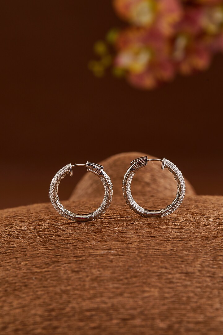 White Gold Finish Zircon Hoops Earrings In Sterling Silver by STELLA CREATIONS at Pernia's Pop Up Shop