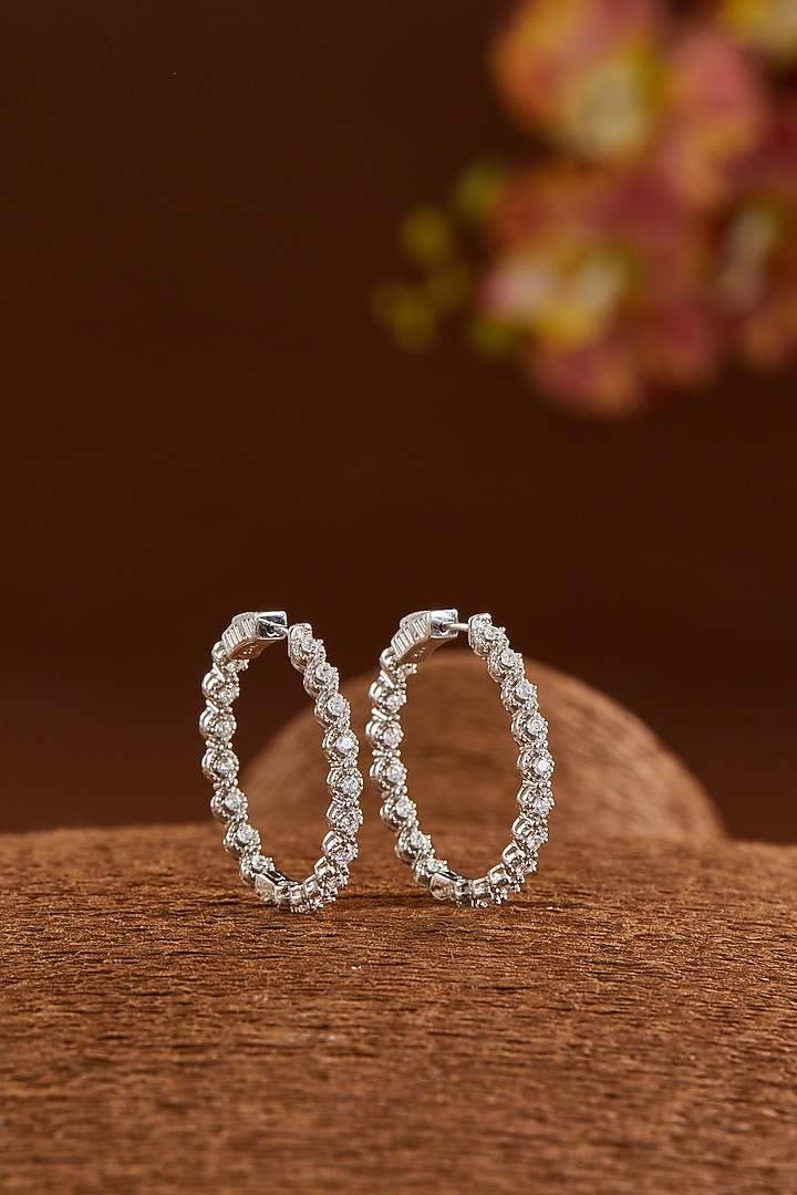 White Gold Finish Zircon Hoop Earrings In Sterling Silver by STELLA CREATIONS at Pernia's Pop Up Shop