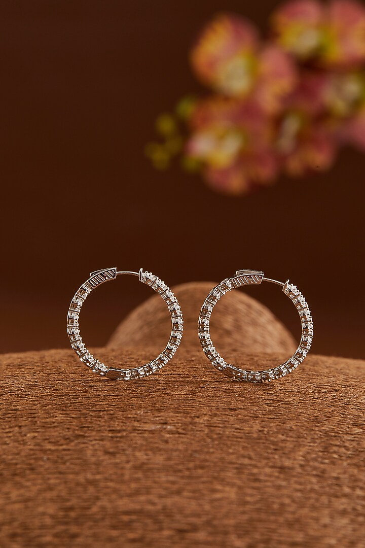 White Gold Finish Zircon Hoop Earrings In Sterling Silver by STELLA CREATIONS at Pernia's Pop Up Shop