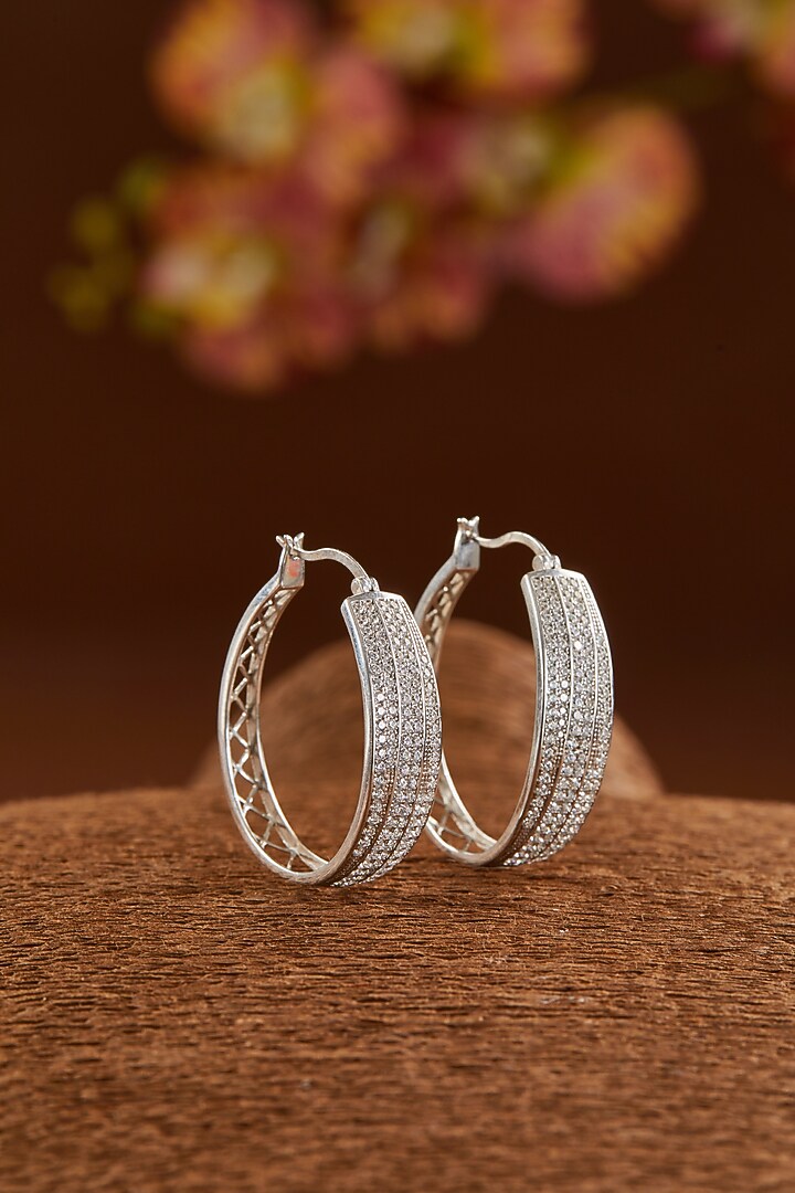 White Gold Finish Zircon Hoop Earrings In Sterling Silver by STELLA CREATIONS at Pernia's Pop Up Shop