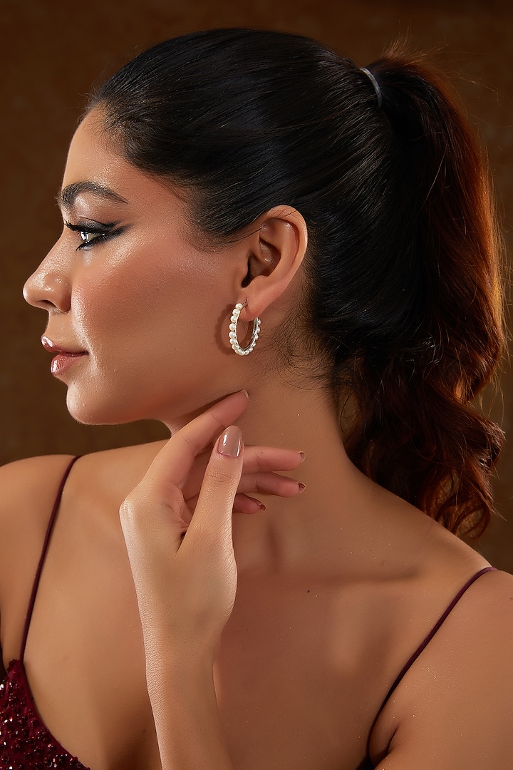 White Gold Finish Zircon & Pearl Hoop Earrings In Sterling Silver by STELLA CREATIONS at Pernia's Pop Up Shop