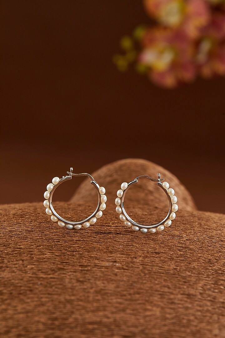 White Gold Finish Zircon & Pearl Hoop Earrings In Sterling Silver by STELLA CREATIONS at Pernia's Pop Up Shop