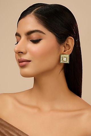 Yellow Gold Finish Moissanite Polki & Glass-Filled Emerald Stone Stud Earrings In Sterling Silver by STELLA CREATIONS