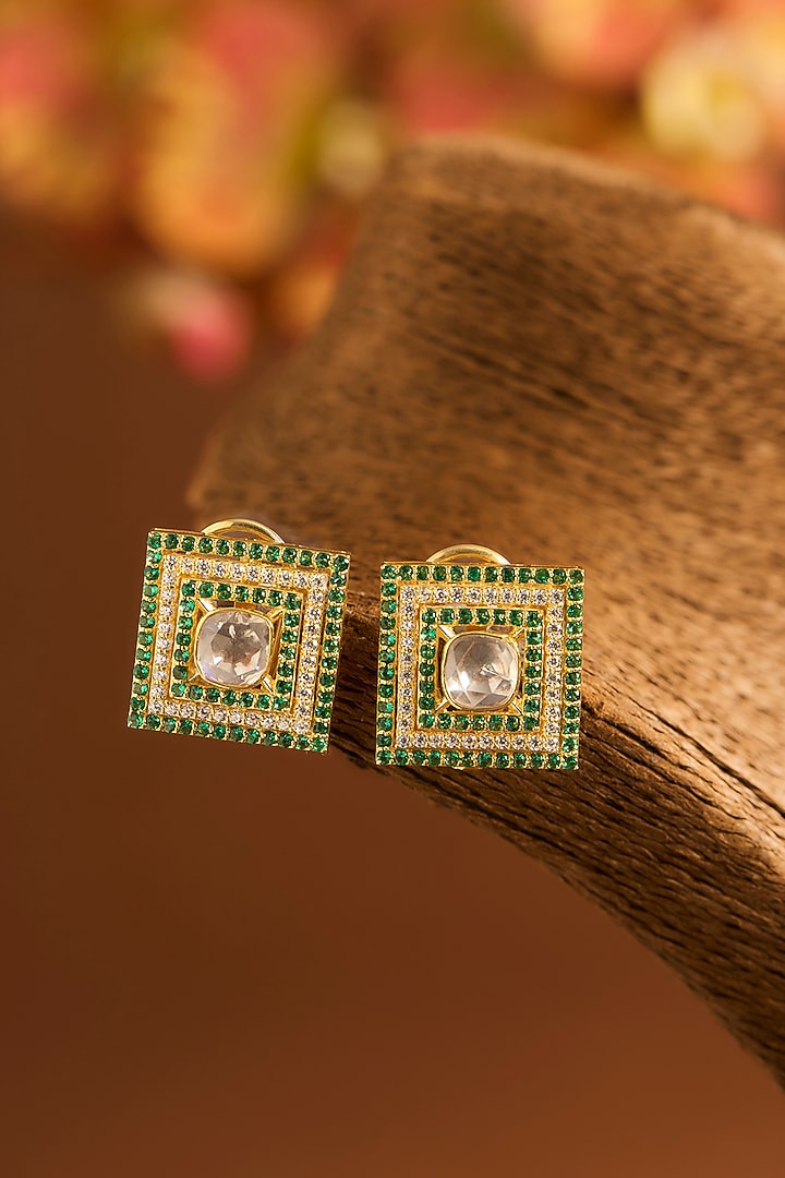 Yellow Gold Finish Moissanite Polki & Glass-Filled Emerald Stone Stud Earrings In Sterling Silver by STELLA CREATIONS at Pernia's Pop Up Shop