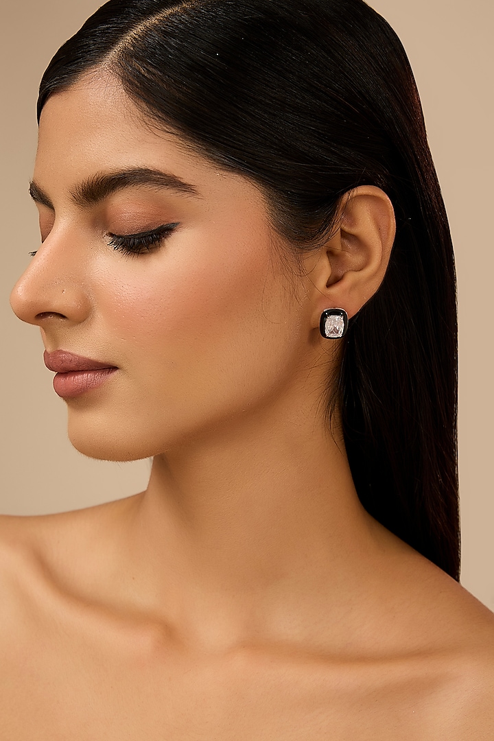 White Gold Finish Eurostar Zircon Black Enameled Stud Earrings In Sterling Silver by STELLA CREATIONS at Pernia's Pop Up Shop