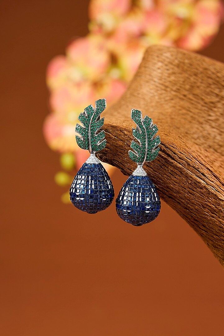 White Gold Finish Sapphire & Emerald Stud Earrings In Sterling Silver by STELLA CREATIONS at Pernia's Pop Up Shop
