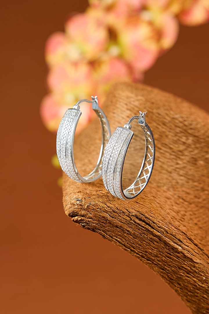 White Gold Finish Eurostar Zircon Hoop Earrings In Sterling Silver by STELLA CREATIONS at Pernia's Pop Up Shop