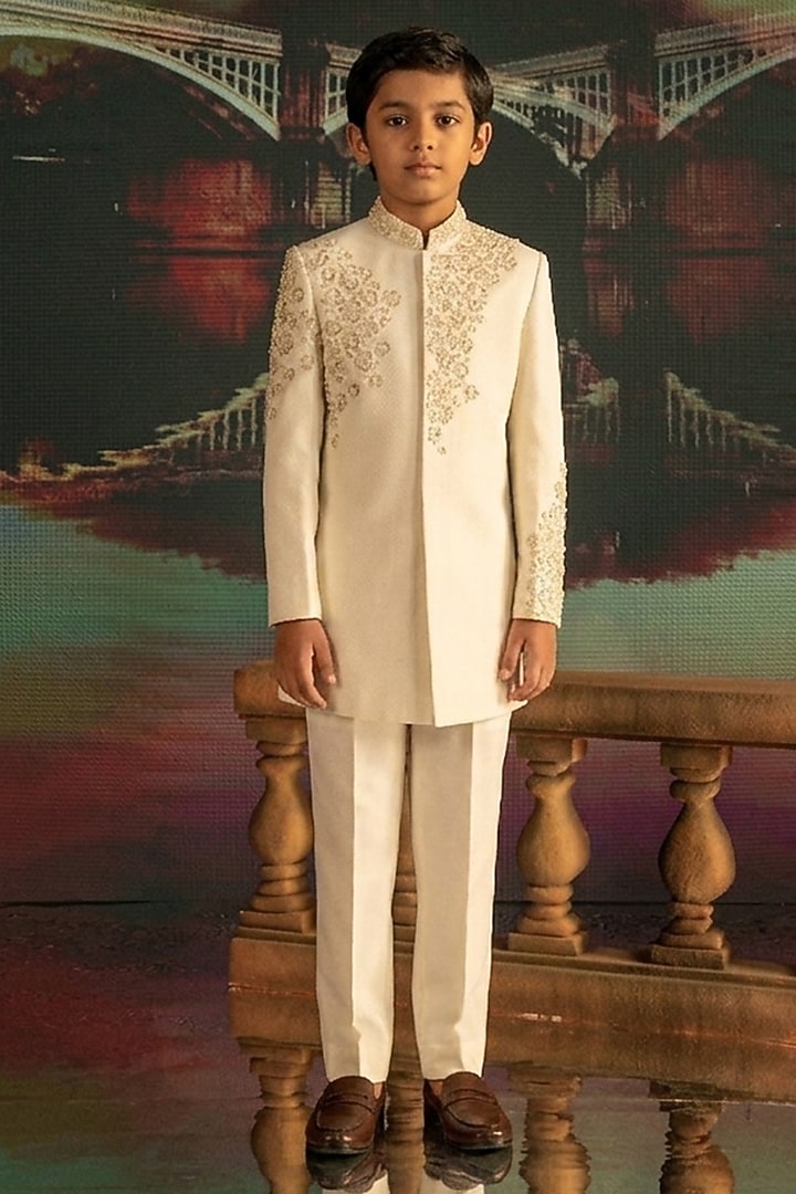 Cream Textured Suiting Hand Embroidered Indowestern Set For Boys by STEEL kids at Pernia's Pop Up Shop