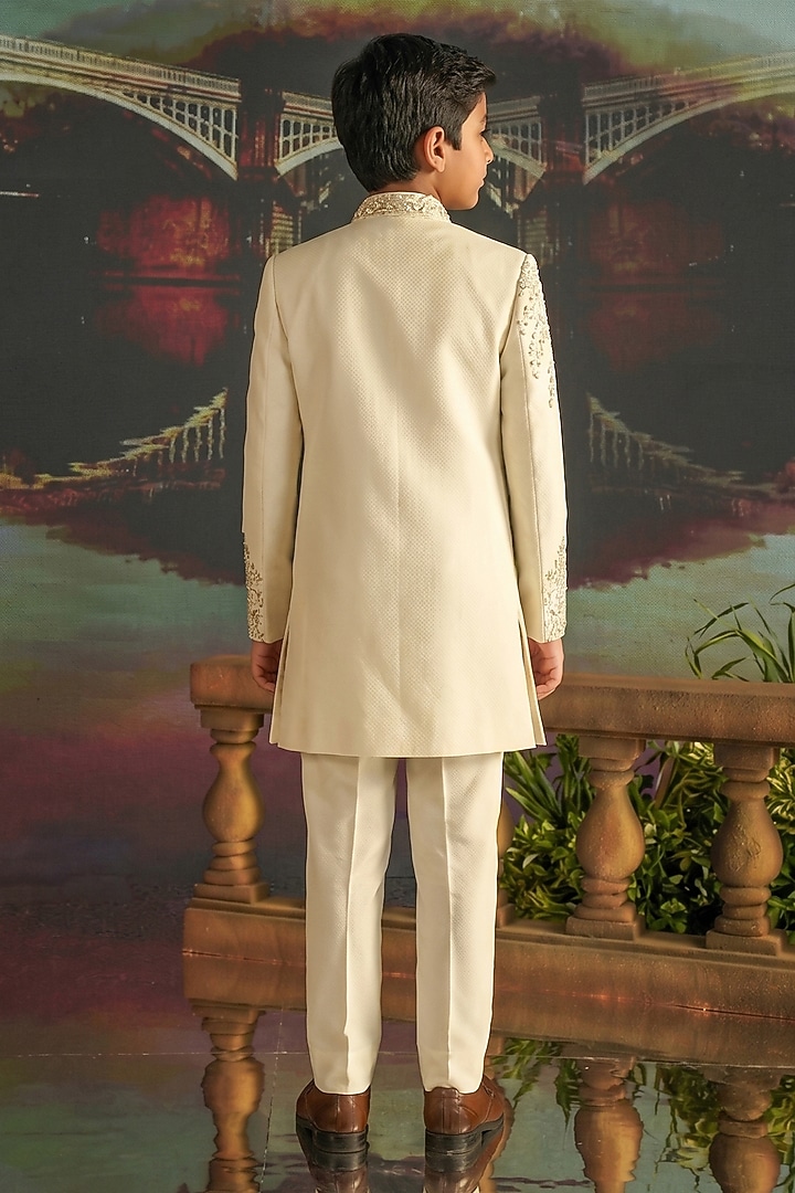Cream Textured Suiting Hand Embroidered Indowestern Set For Boys by STEEL kids at Pernia's Pop Up Shop