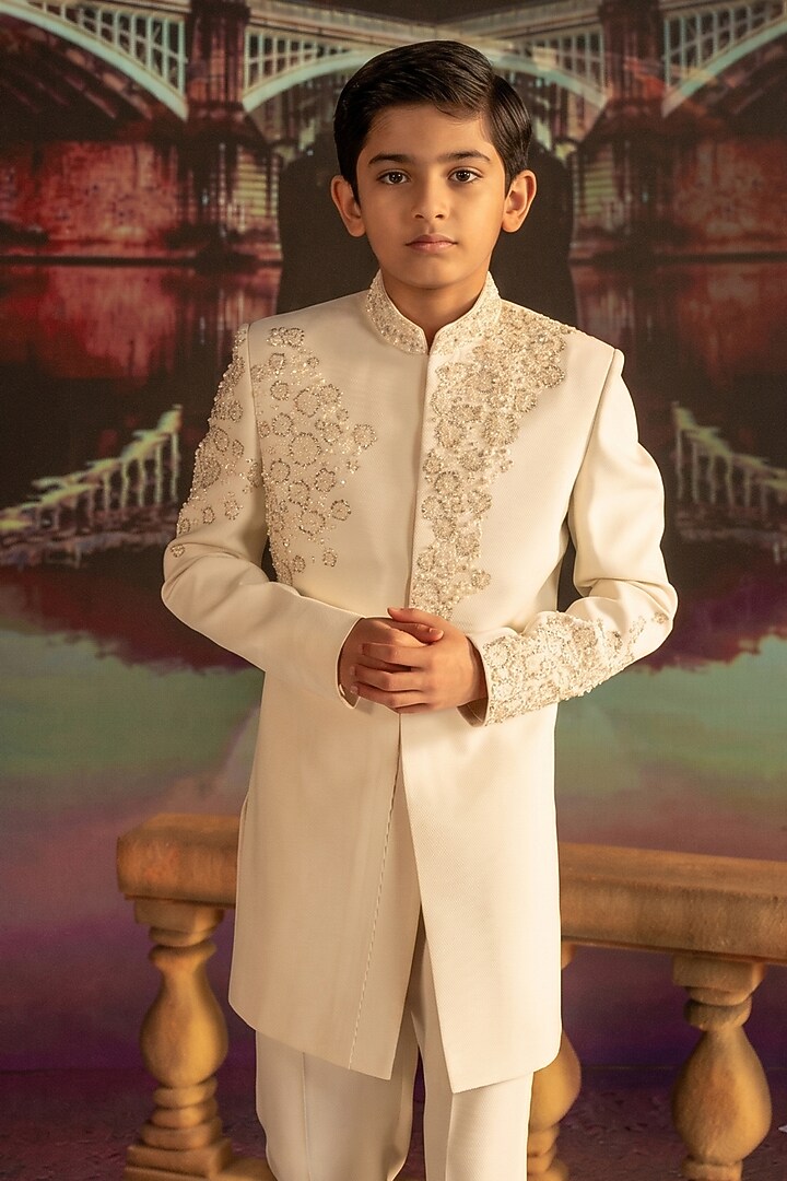 Cream Textured Suiting Hand Embroidered Indowestern Set For Boys by STEEL kids at Pernia's Pop Up Shop