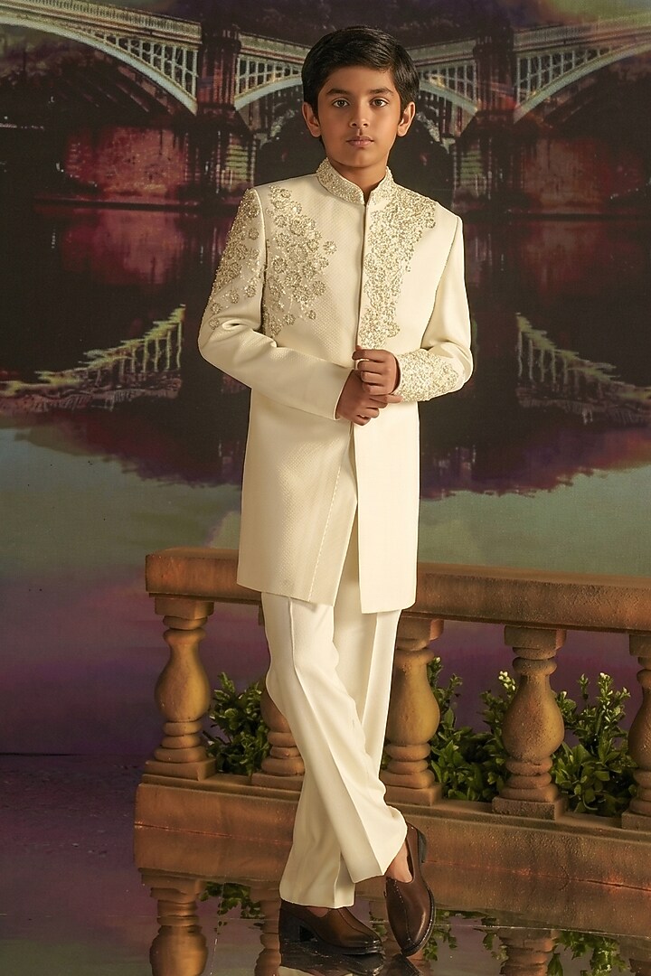 Cream Textured Suiting Hand Embroidered Indowestern Set For Boys by STEEL kids at Pernia's Pop Up Shop