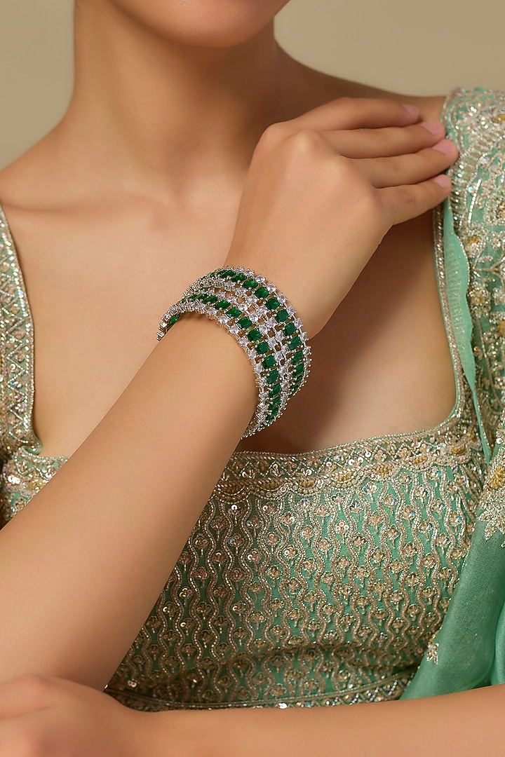 White Finish Zircon & Emerald Green Stone Bangles (Set Of 2) by Studio6 Jewels at Pernia's Pop Up Shop