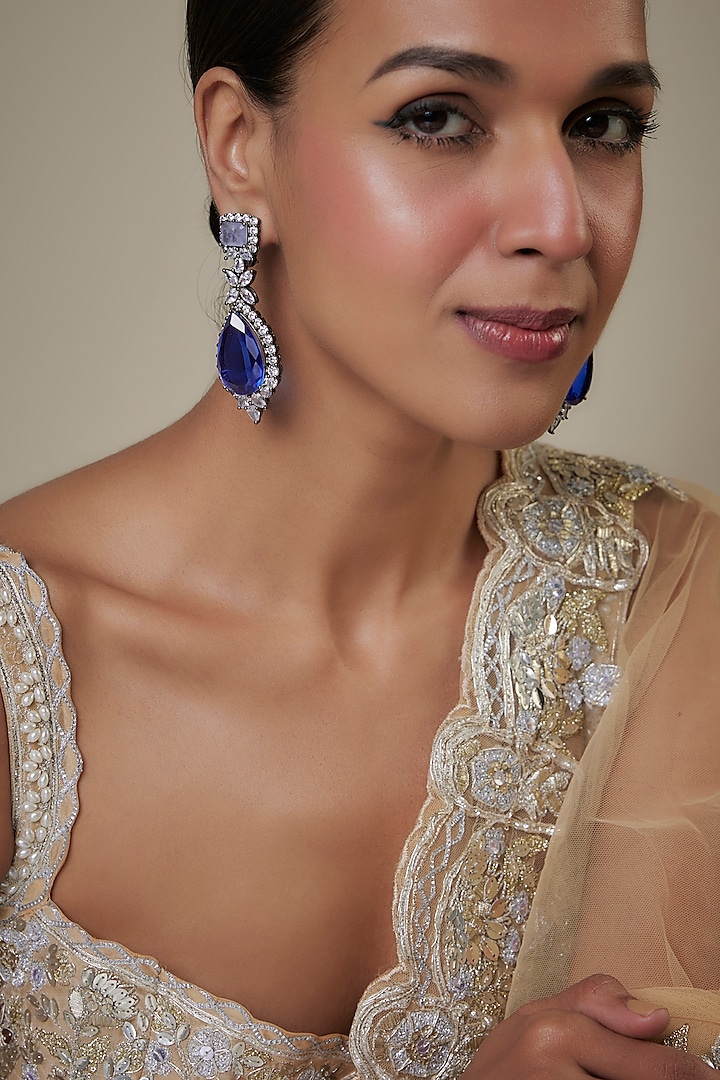 White Finish Blue Zircon Dangler Earrings by Studio6 Jewels at Pernia's Pop Up Shop