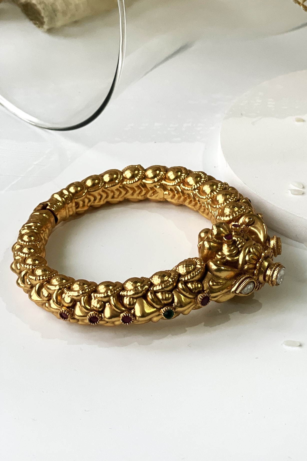 Gold Finish Pink Green Stone Temple Kada by Studio6 Jewels at - Main Image