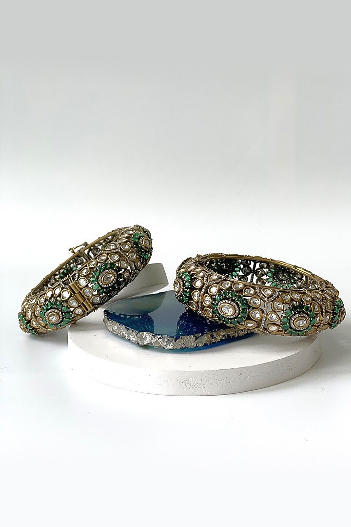Two-Tone Finish Kundan Polki & Green Stone Bangles (Set Of 2) by Studio6 Jewels at Pernia's Pop Up Shop