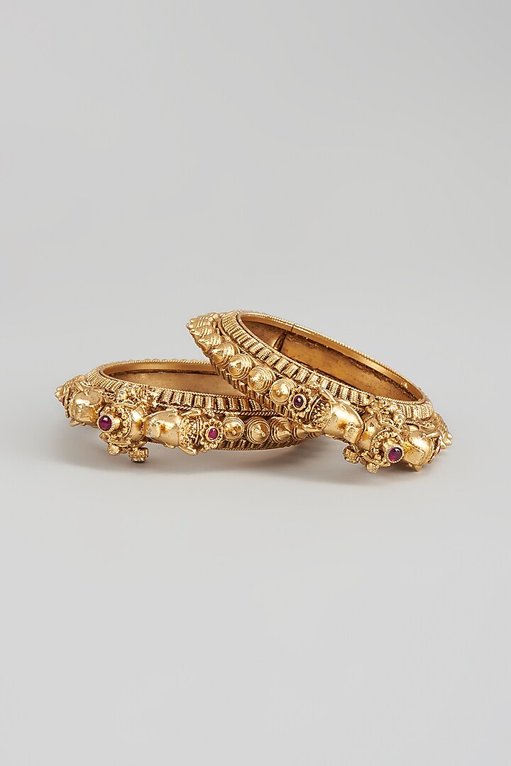 Gold Finish Motif Temple Bangles (Set of 2) by Studio6 Jewels at Pernia's Pop Up Shop