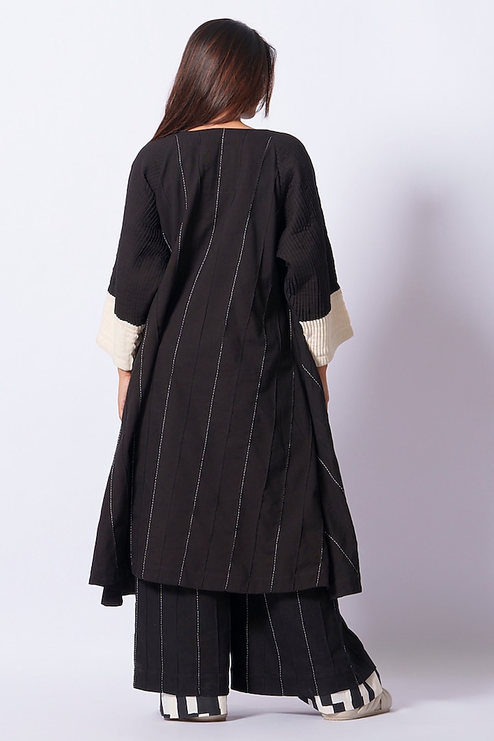 Black Cotton Matty Flared Trousers by STOIQUE at Pernia's Pop Up Shop