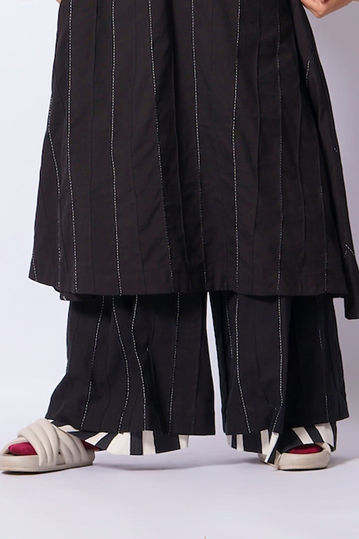 Black Cotton Matty Flared Trousers by STOIQUE at Pernia's Pop Up Shop