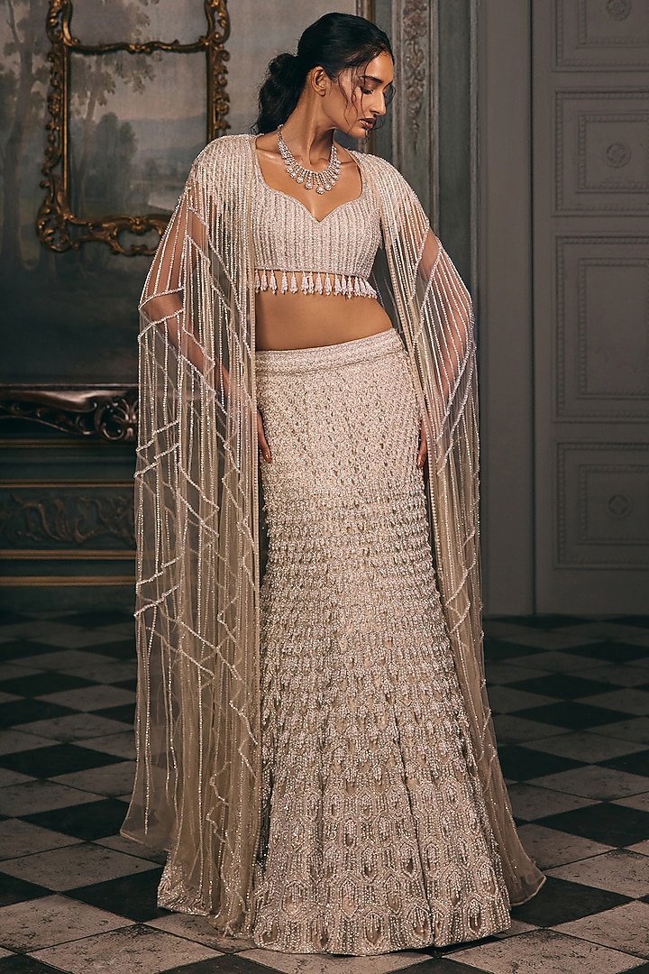 Ivory Beige Shimmer & Net Sequin Hand Embroidered Jacket Bridal Lehenga Set by Studio22 by Pulkita Arora Bajaj at Pernia's Pop Up Shop