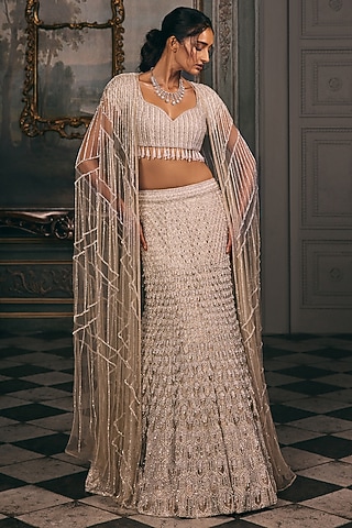 Ivory Beige Shimmer & Net Sequin Hand Embroidered Jacket Lehenga Set by Studio22 by Pulkita Arora Bajaj