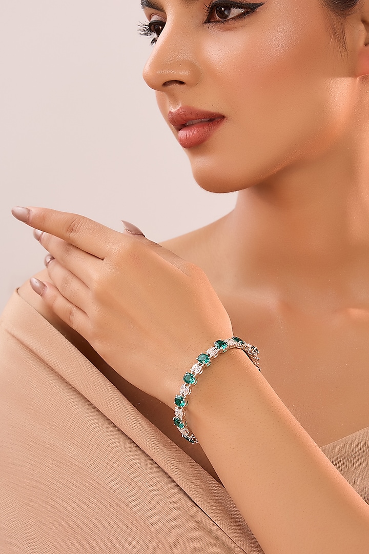 White Gold Finish Eurostar Zircon & Emerald Stone Bangle In Sterling Silver by STELLA CREATIONS at Pernia's Pop Up Shop