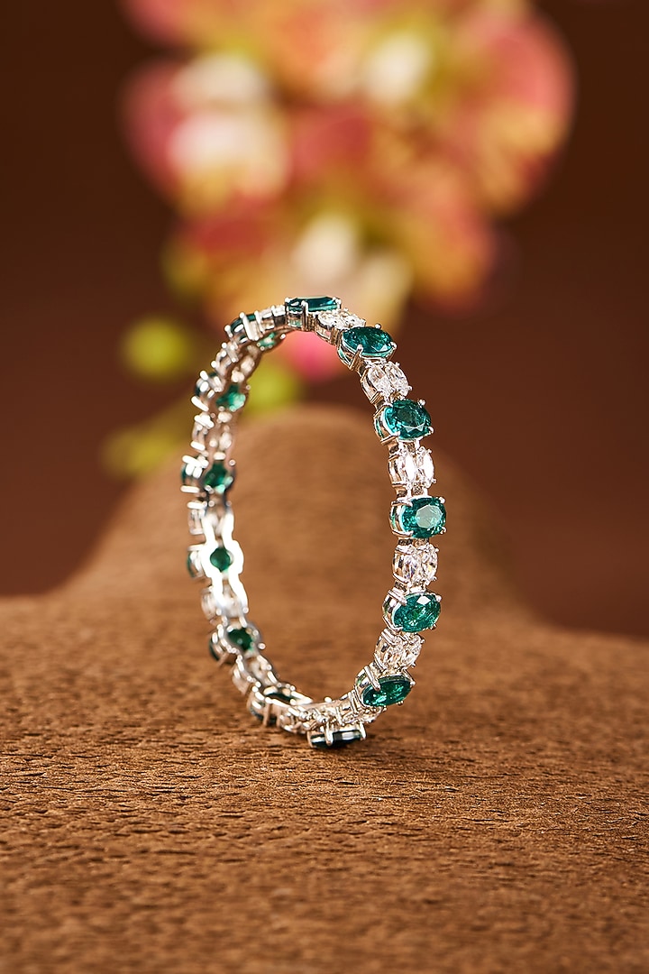 White Gold Finish Eurostar Zircon & Emerald Stone Bangle In Sterling Silver by STELLA CREATIONS at Pernia's Pop Up Shop