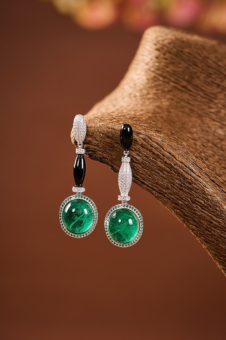 White Gold Finish Eurostar Zircon & Emerald Stone Black Enameled Dangler Earrings In Sterling Silver by STELLA CREATIONS at Pernia's Pop Up Shop