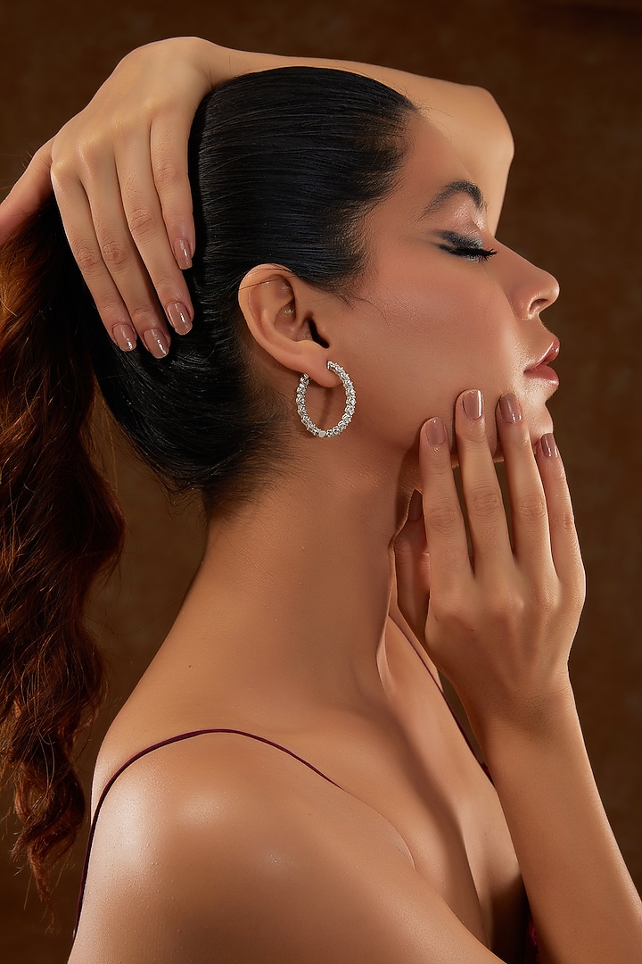 White Gold Finish Zircon Hoop Earrings In Sterling Silver by STELLA CREATIONS at Pernia's Pop Up Shop