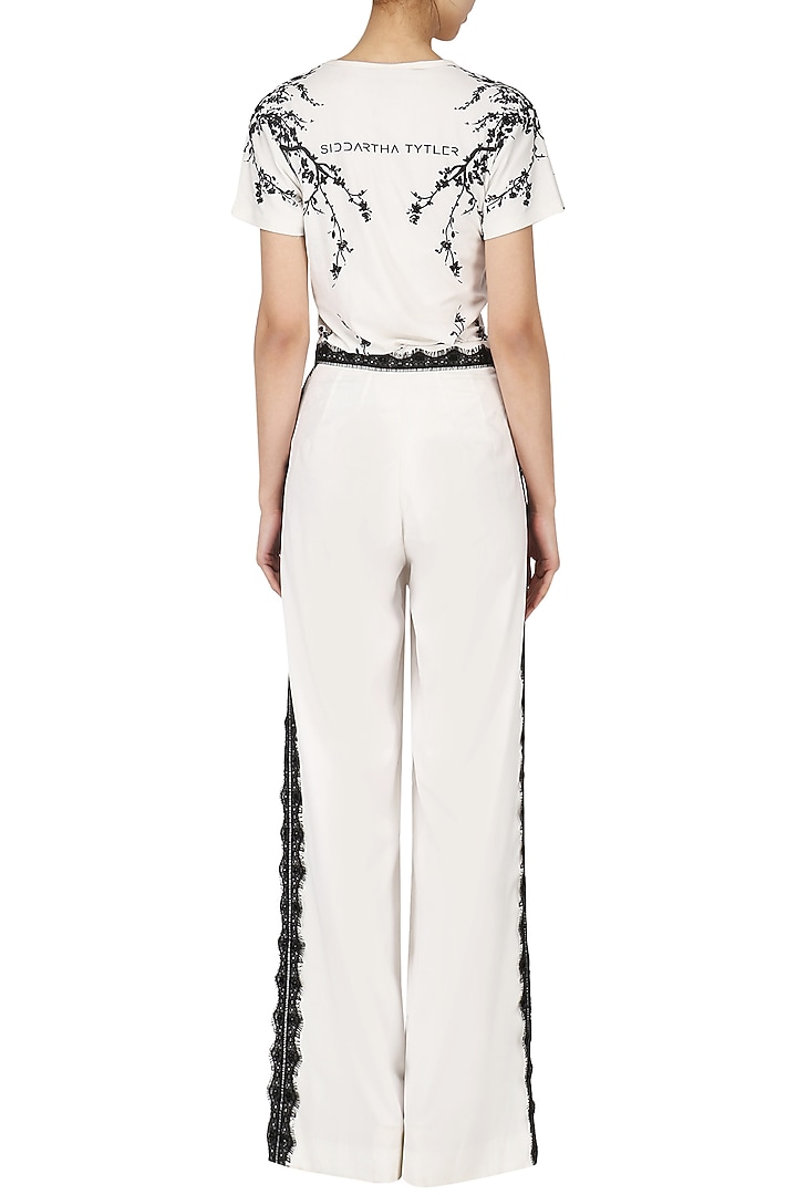 Ivory lace trim pants available only at Pernia's Pop Up Shop.