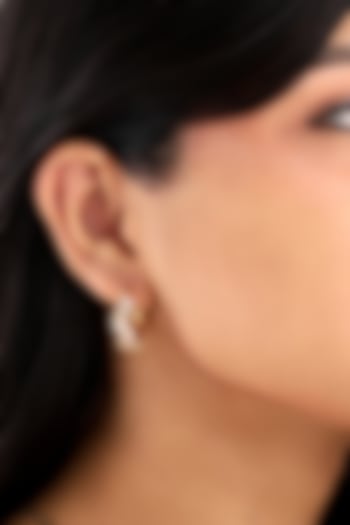 Gold Finish Cubic Zirconia Huggie Earrings by SUCRA at Pernia's Pop Up Shop