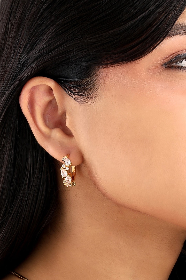 Gold Finish Cubic Zirconia Huggie Earrings by SUCRA at Pernia's Pop Up Shop